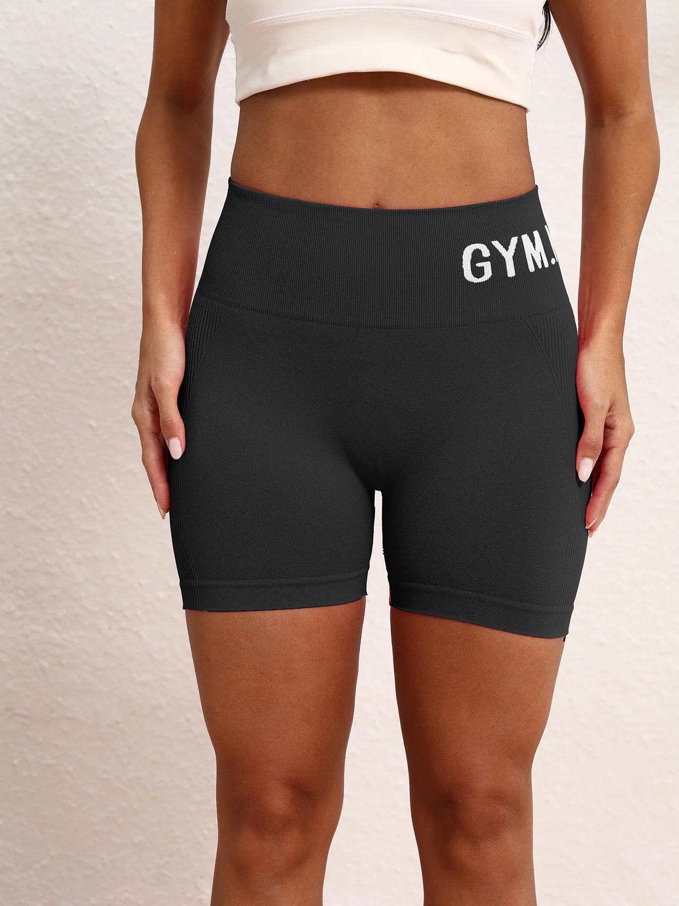 Ladies' seamless, high-elastic three-point fitness letter-shaped shorts, high-waisted peach-buttock sports hip-lifting shorts