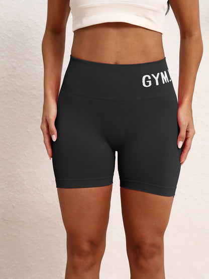 Ladies' seamless, high-elastic three-point fitness letter-shaped shorts, high-waisted peach-buttock sports hip-lifting shorts